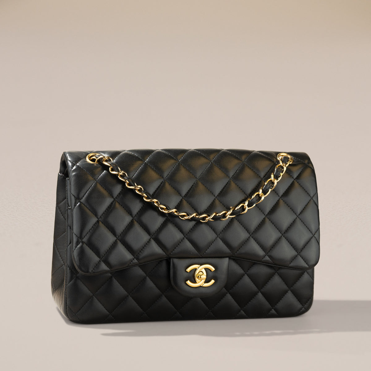 Chanel Jumbo Classic Double Flap, Black Lambskin — angled front