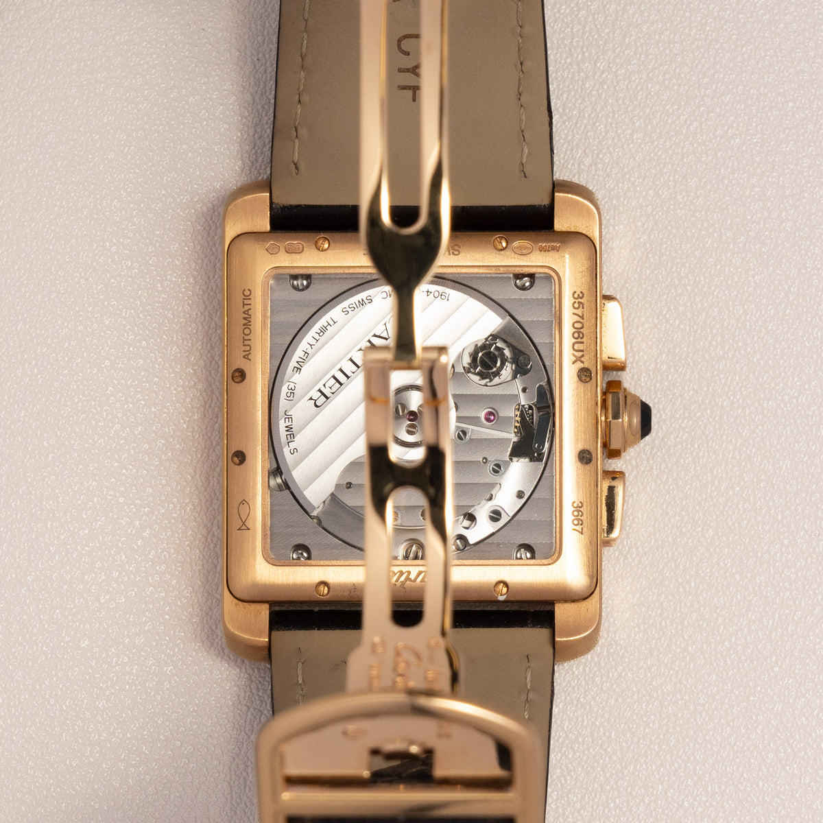 Cartier Tank MC Chronograph, 18K Rose Gold — calibre 1904-CH MC through the sapphire case back