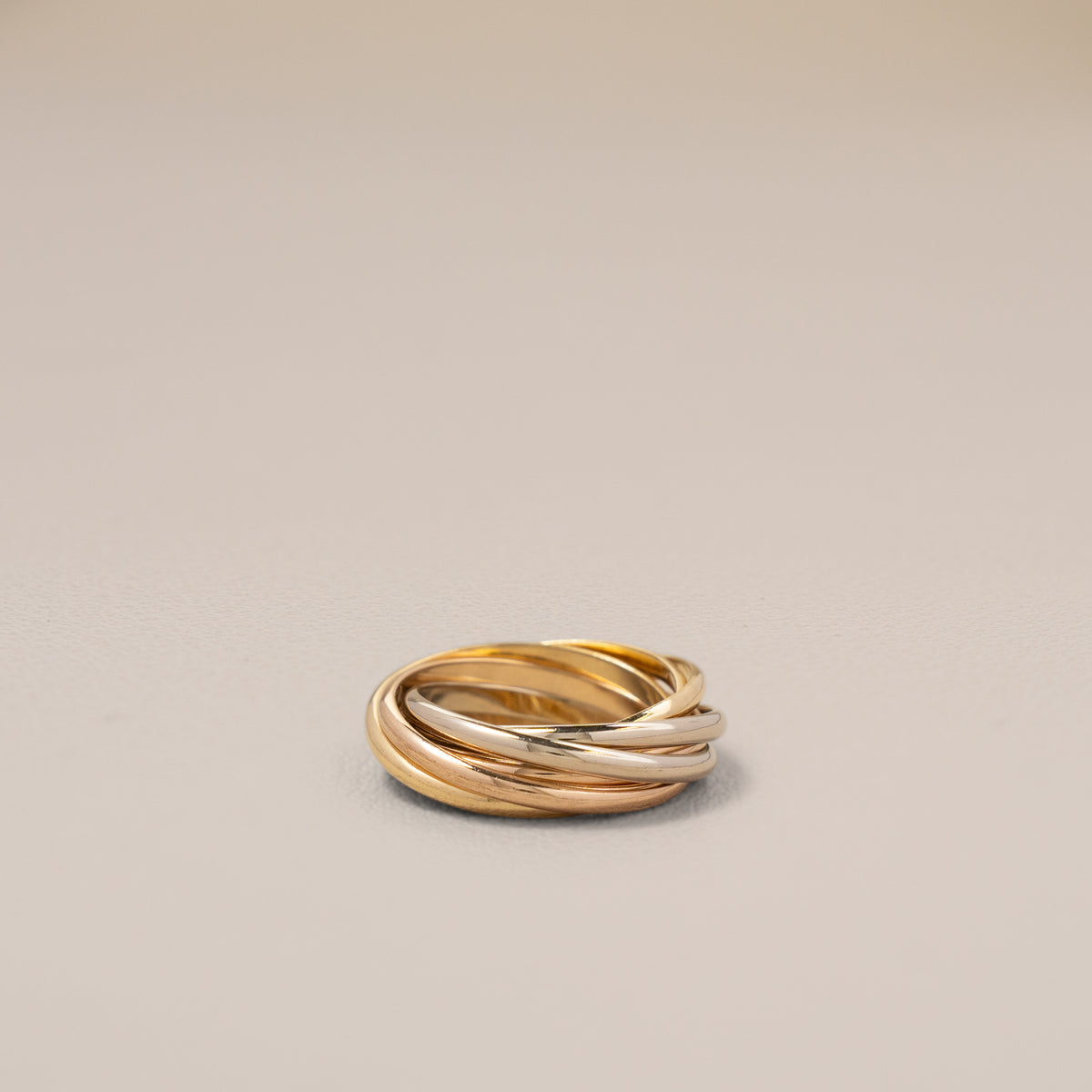Cartier 18K Three-Colour Gold Seven-Band Trinity Ring, Size 46 — angle