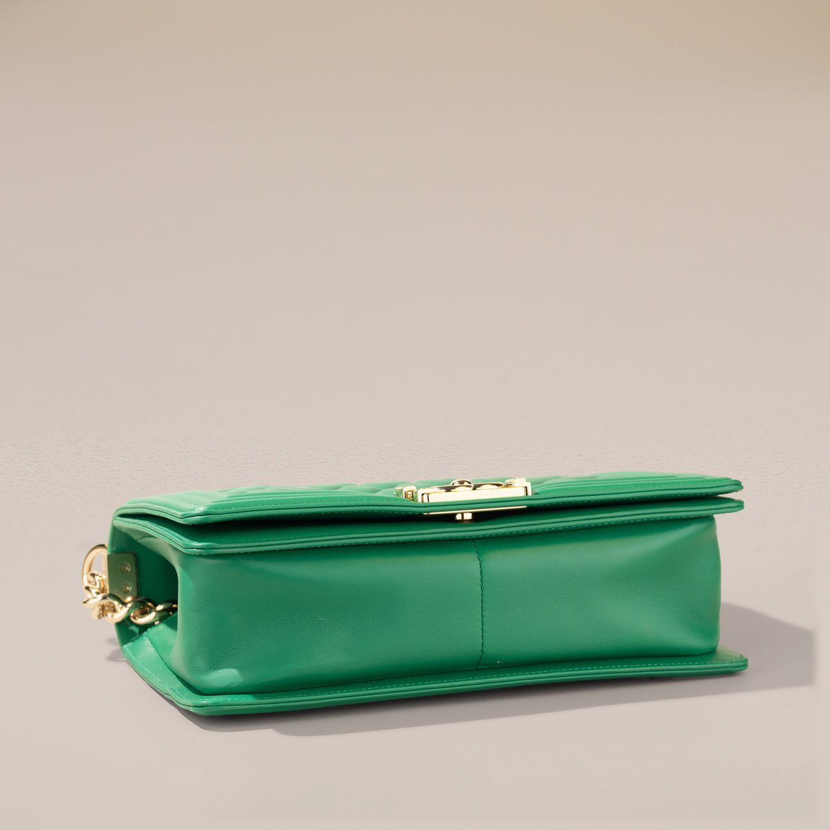 Chanel Old Medium Boy Bag, Green Lambskin — base, angle