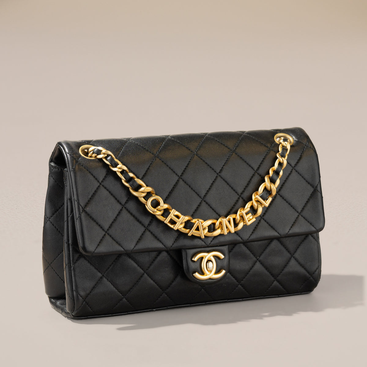 Chanel Logo Letters Flap Bag, Black Lambskin — angle