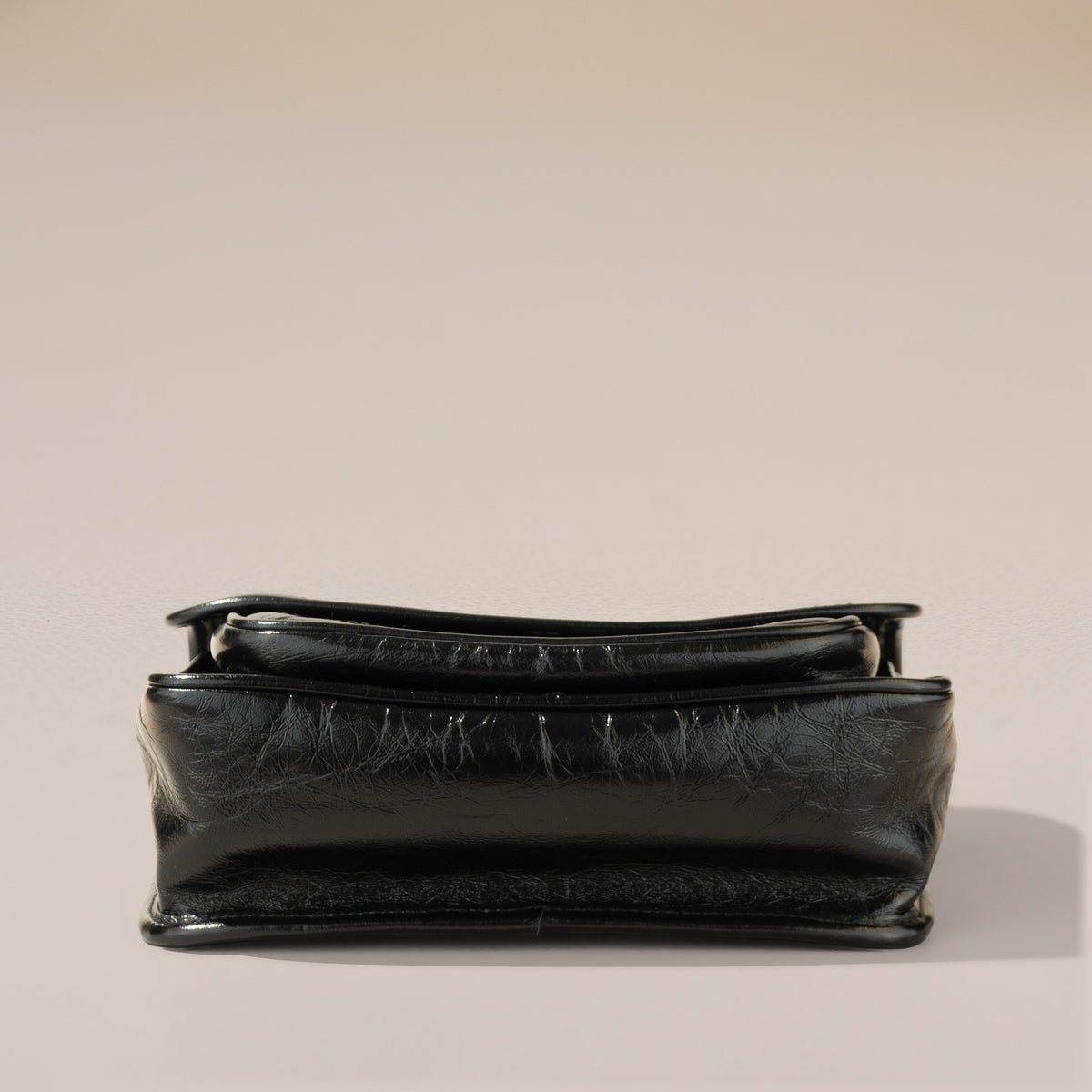 Saint Laurent Niki Baby, Black Crinkled Vintage Leather — base