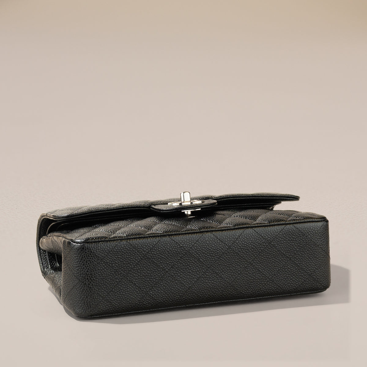 Chanel Small Classic Double Flap, Black Caviar — base, angle