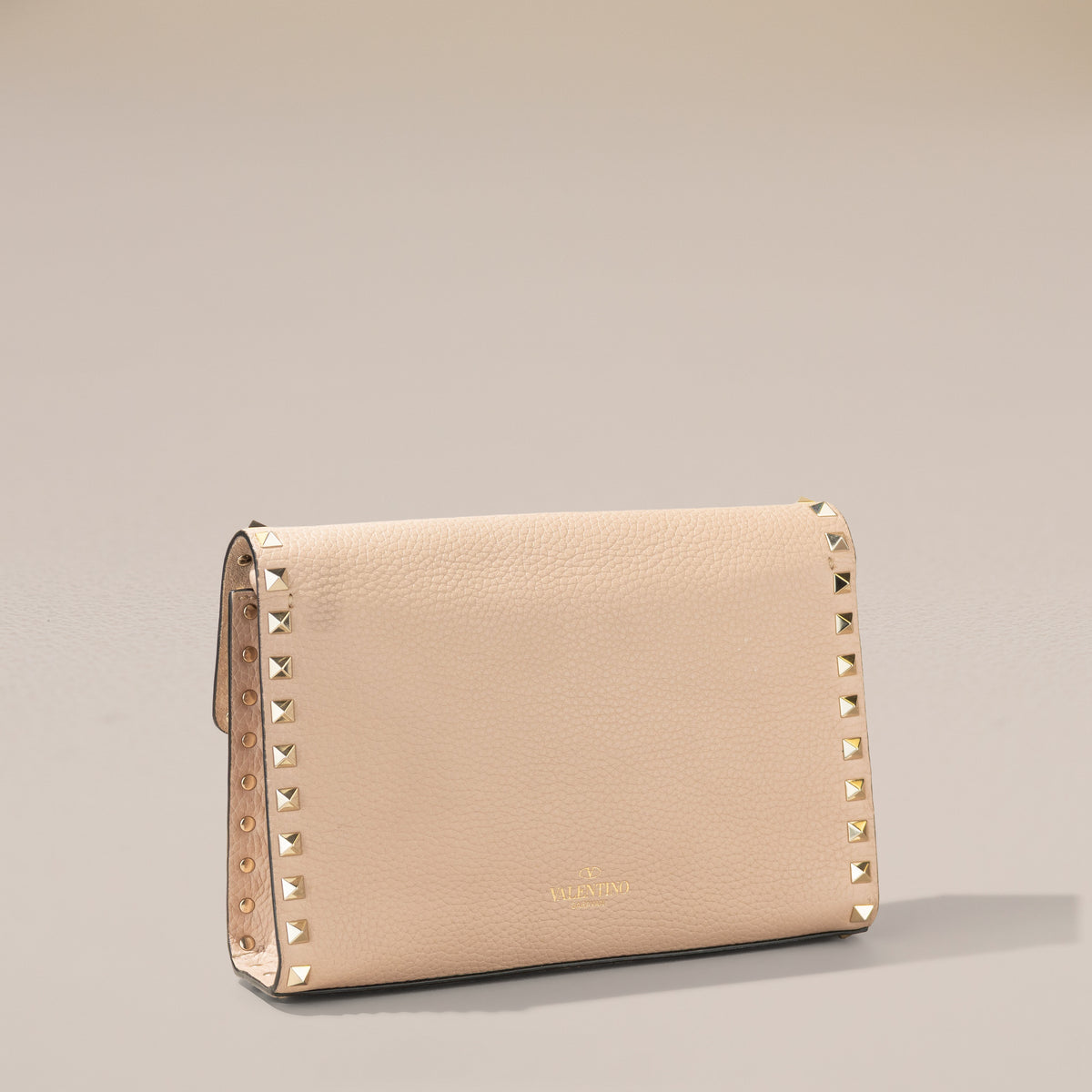 Valentino Garavani Small Rockstud Crossbody, Poudre Grainy Calfskin — back, angle