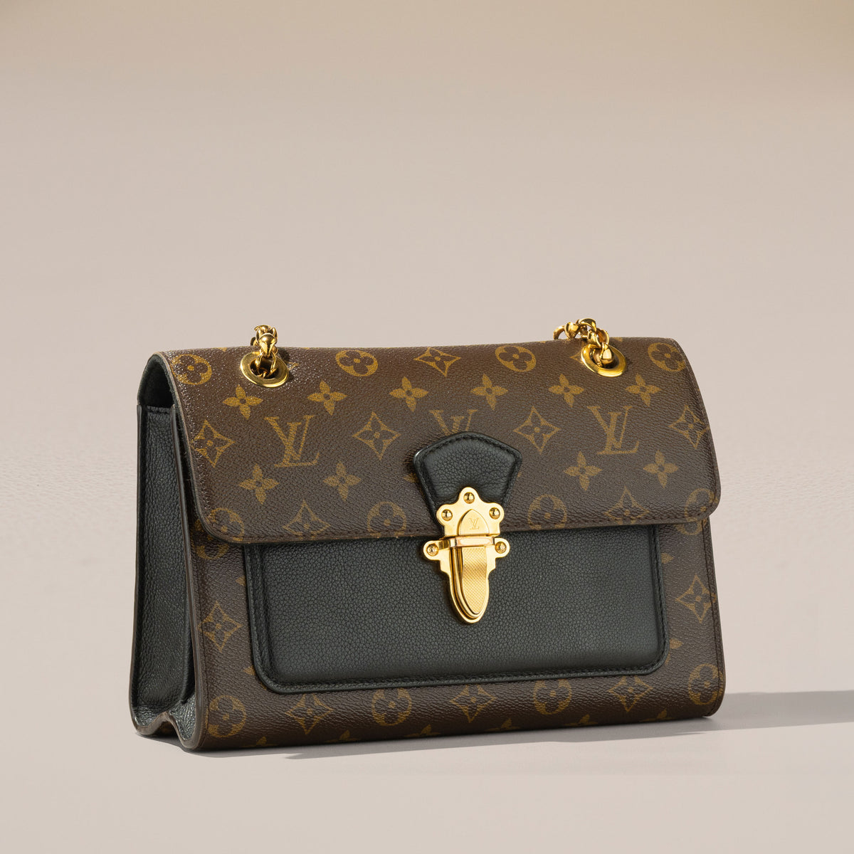Louis Vuitton Victoire, Monogram and Black Leather — angle