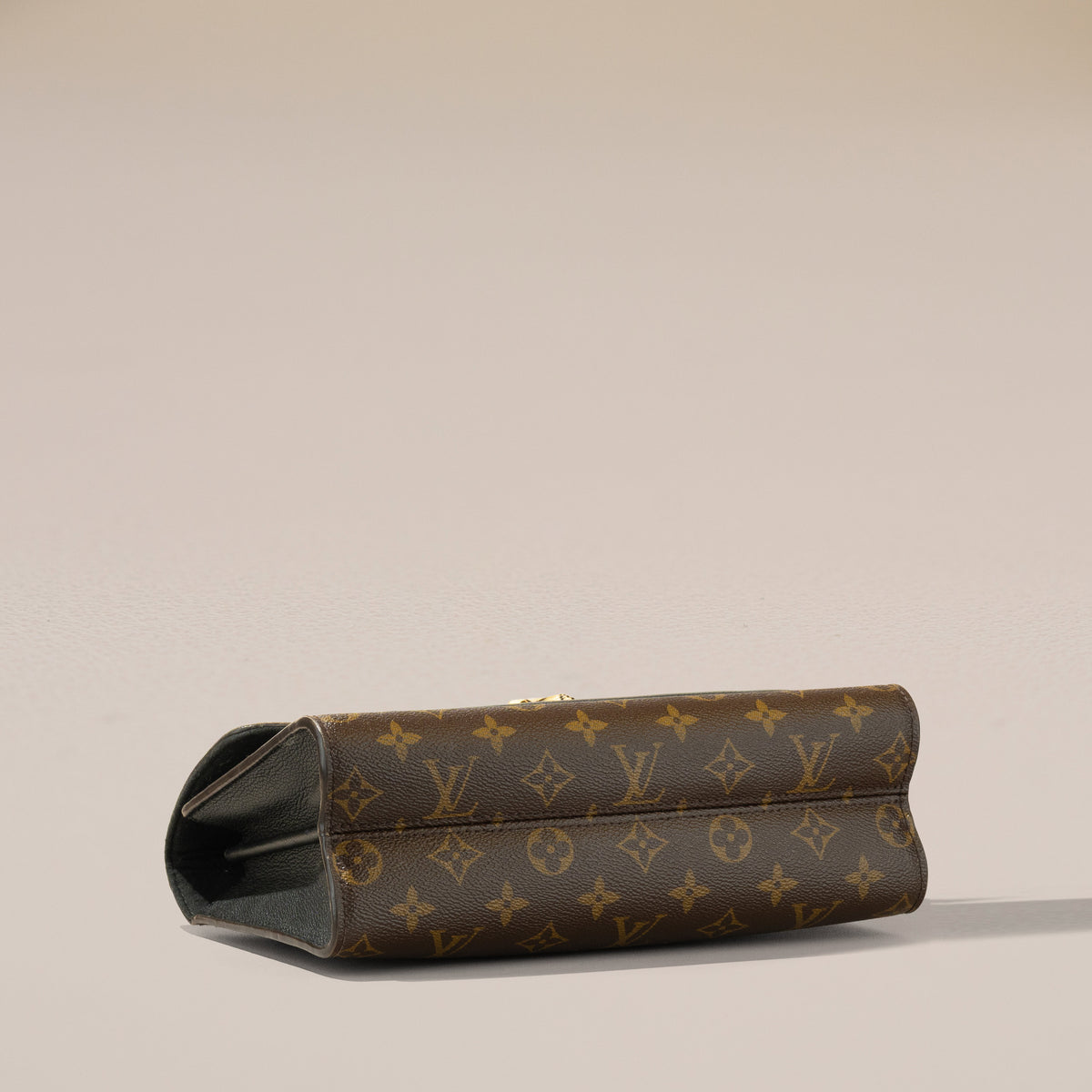 Louis Vuitton Victoire, Monogram and Black Leather — base, angle