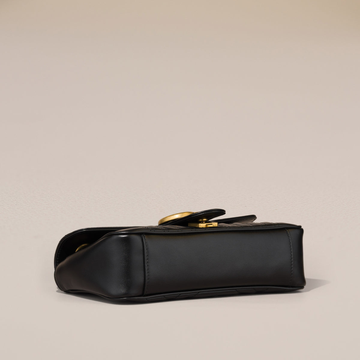 Gucci GG Marmont Small Shoulder Bag, Black Matelassé Leather — base, angled