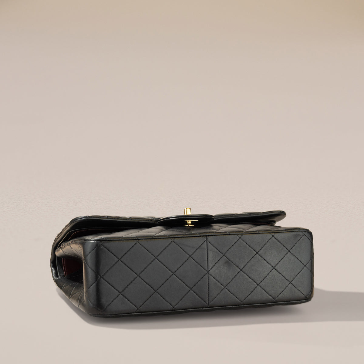 Chanel Jumbo Classic Double Flap, Black Lambskin — angled base