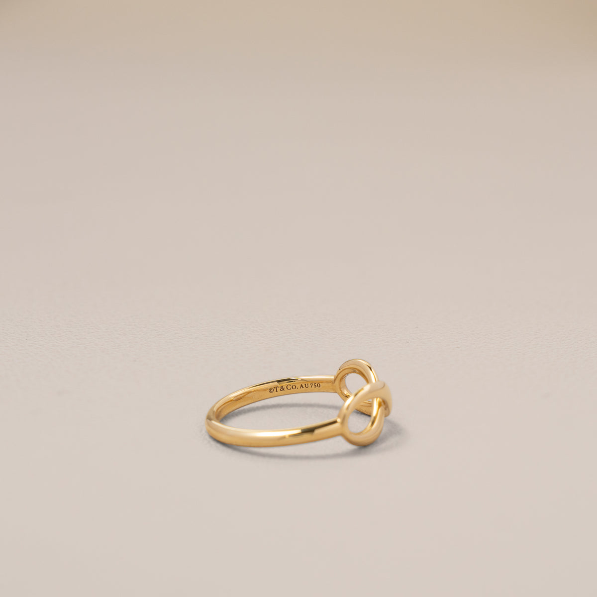 Tiffany & Co. 18K Yellow Gold Infinity Ring, Size 8 — inside, hallmarks