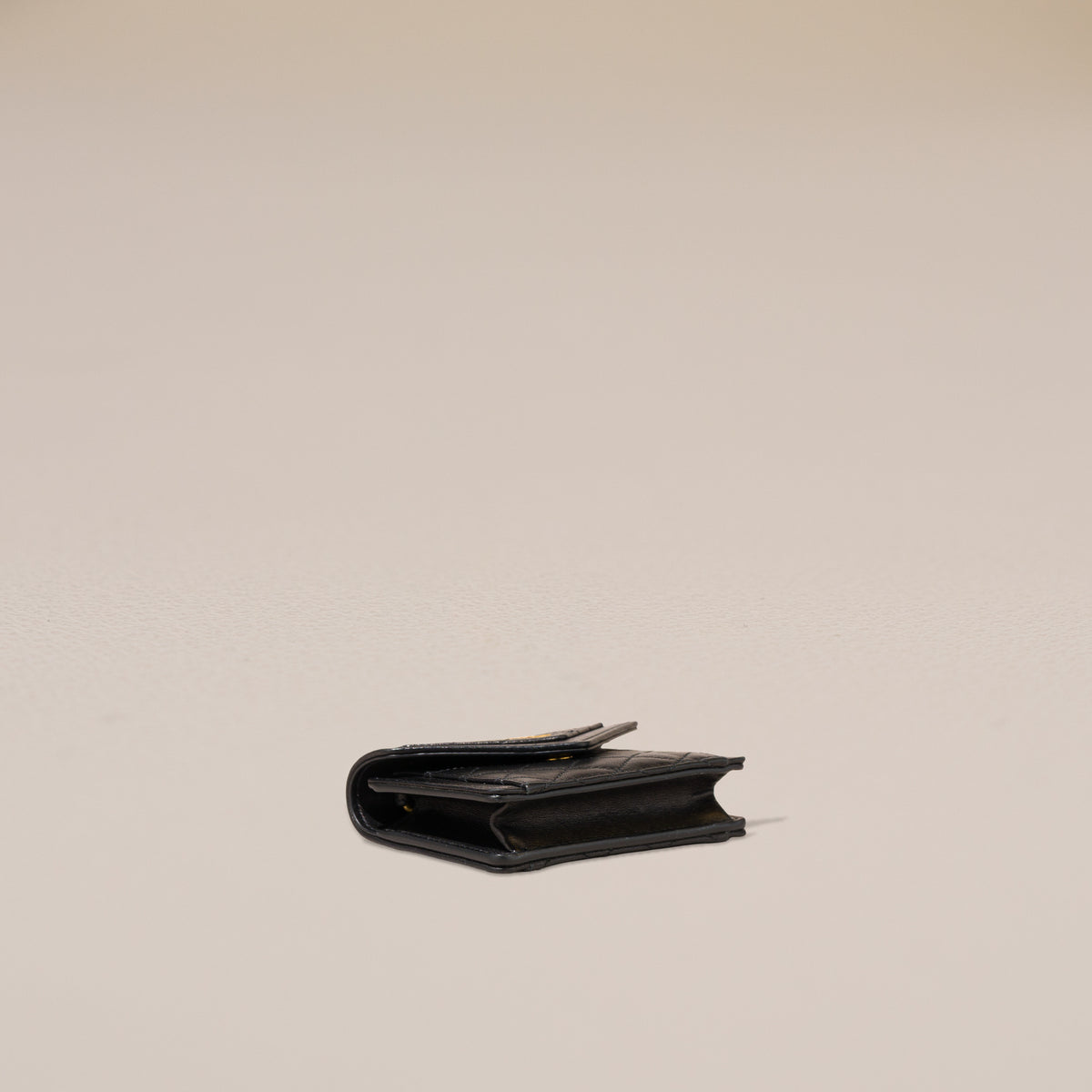 Saint Laurent Gaby Micro Bag, Black Quilted Lambskin — base, angled