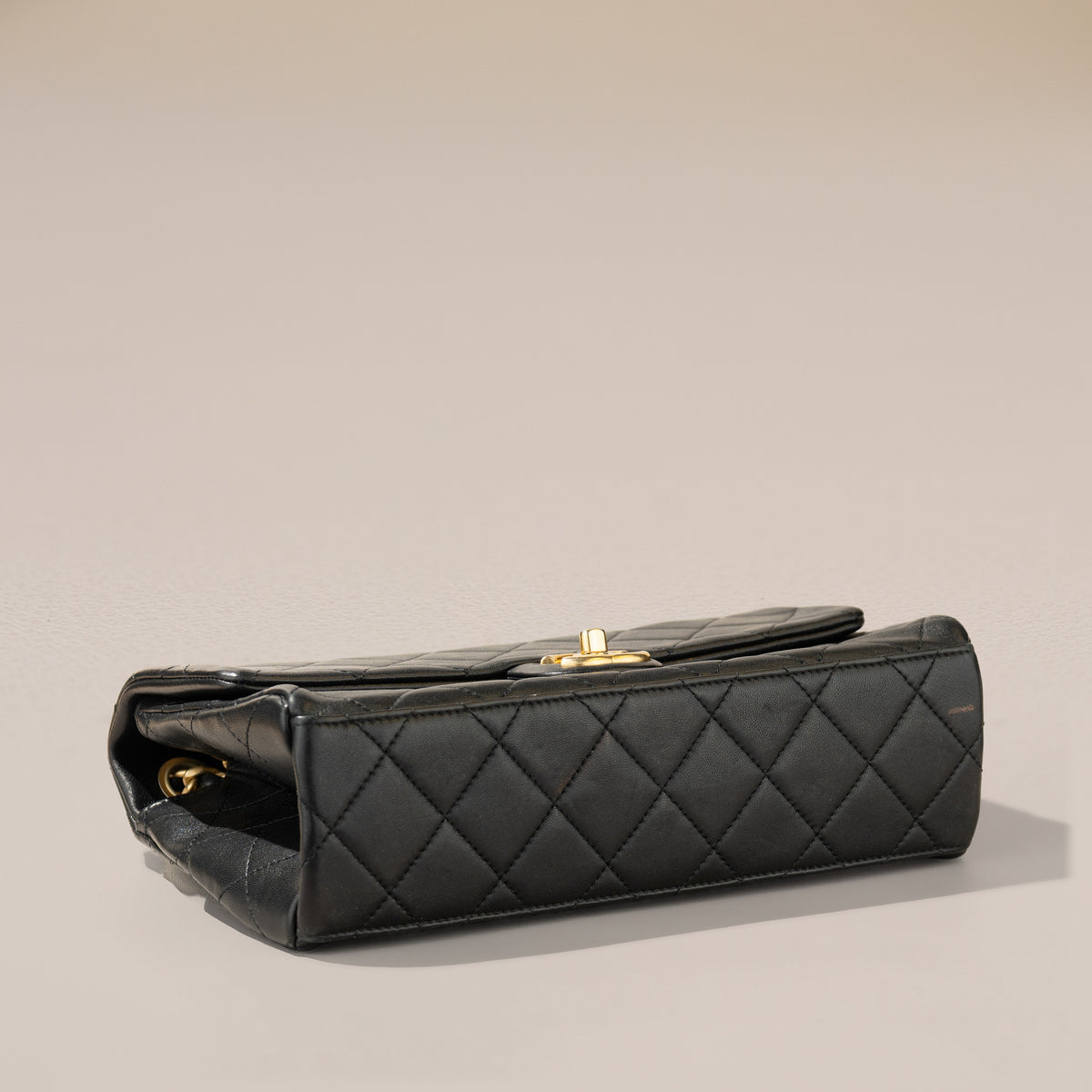 Chanel Logo Letters Flap Bag, Black Lambskin — base, angle