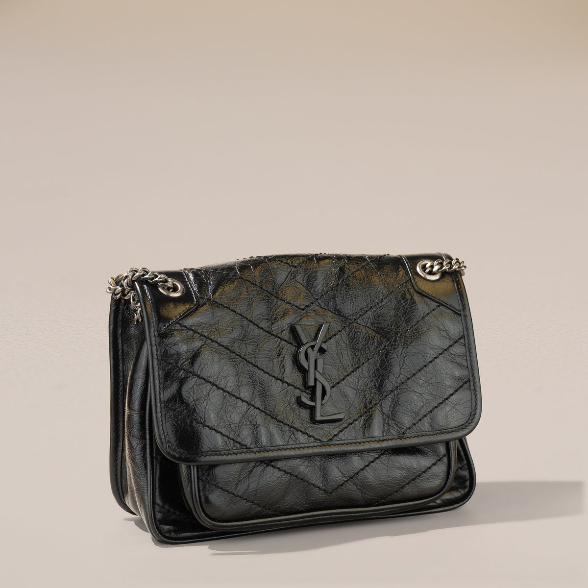 Saint Laurent Niki Baby, Black Crinkled Vintage Leather — angle