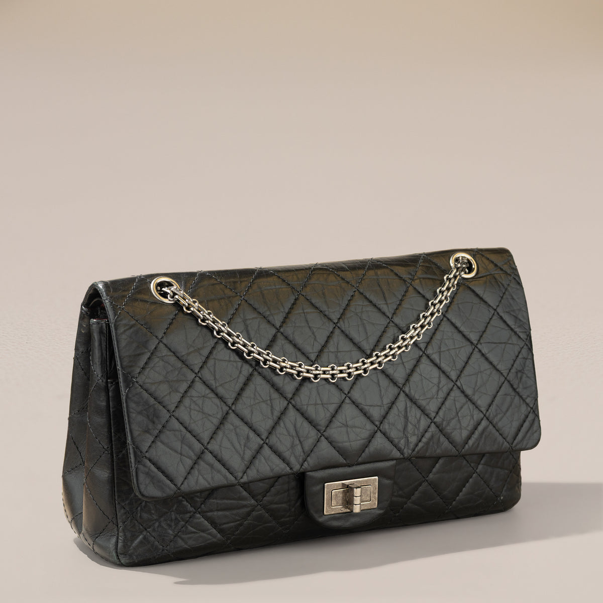 Chanel 2.55 Reissue 227, Black Aged Calfskin — angle