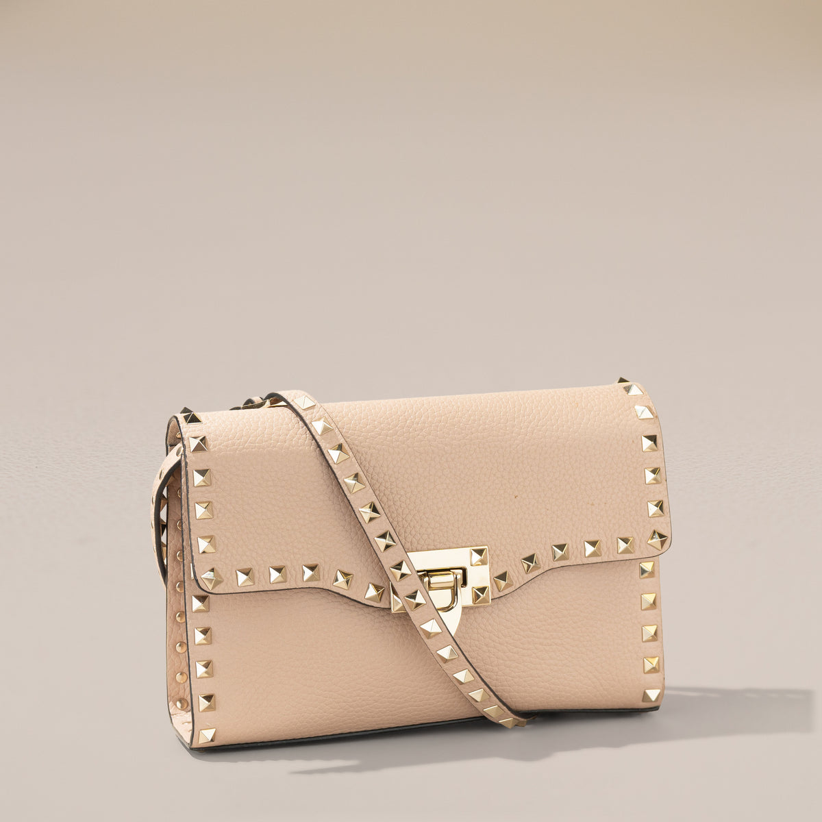 Valentino Garavani Small Rockstud Crossbody, Poudre Grainy Calfskin — angle